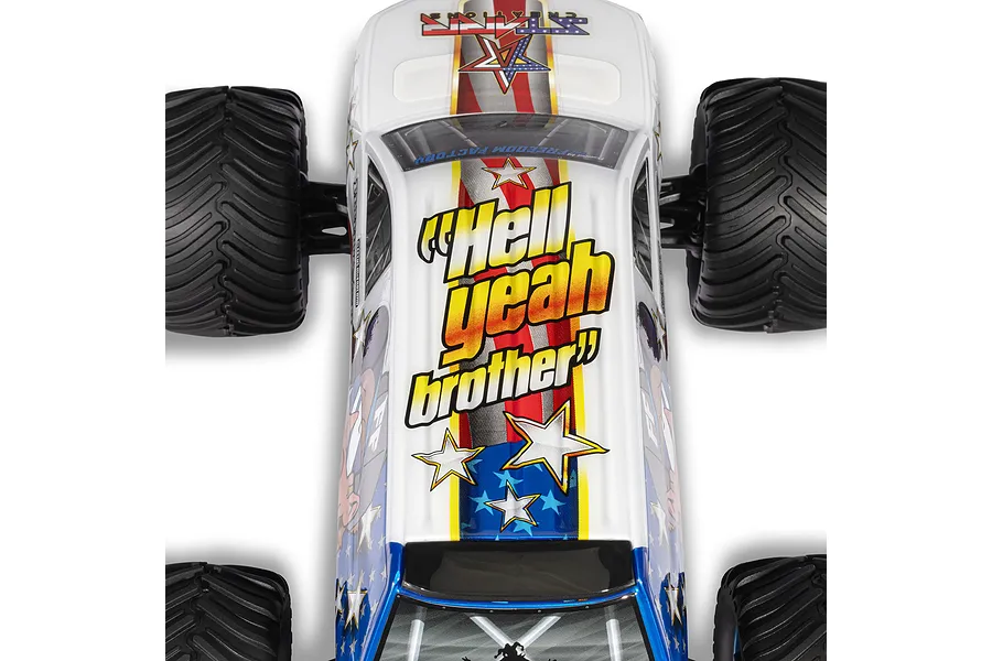 Top-down view of the ARRMA Freedom Flyer Grom RC monster truck showing the white body with patriotic star and stripe graphics and Hell Yeah Brother text.