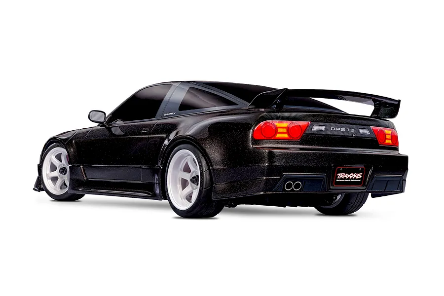 Rear three-quarter view of a black Traxxas Nissan 240SX RC drift car with white wheels on a white background.
