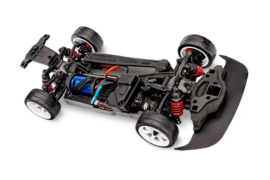 High-angle studio shot of a Traxxas 4-Tec 2.0 RC car chassis showing the drivetrain, blue electric motor, and red coil-over shocks.