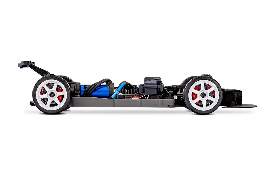 Side profile view of a Traxxas 4-Tec 2.0 RC car chassis without a body shell, showing the blue electric motor, white wheels, and black frame.