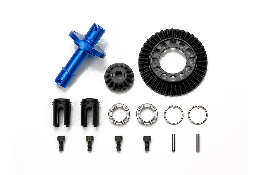Tamiya front direct coupling set including blue aluminium shaft, black bevel gears, bearings, clips, and screws on a white background.