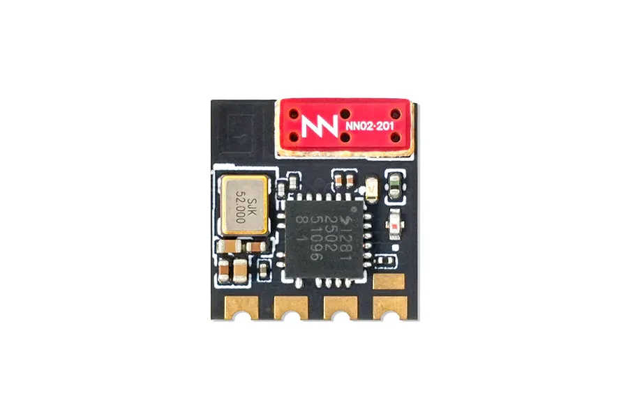 Top-down view of a BetaFPV 2.4GHz ELRS Lite receiver circuit board featuring a flat ceramic antenna and various electronic components on a black PCB.