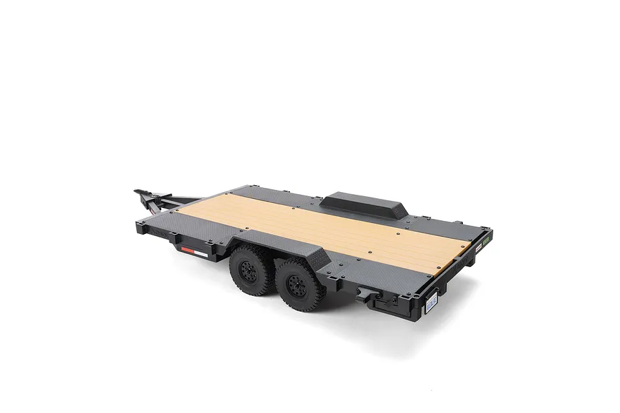 Axial 1/10 scale flat bed vehicle trailer in black with wood-look deck, featuring dual axles and realistic detailing on a white background.