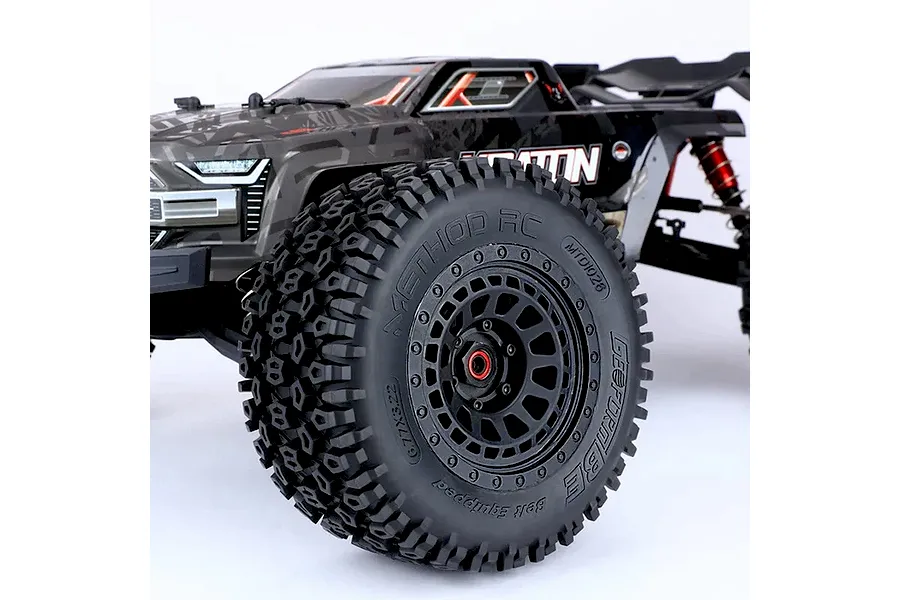 Close-up of a Method RC 3.8 Geoform belted tyre mounted on a black Array wheel, attached to an RC truck.