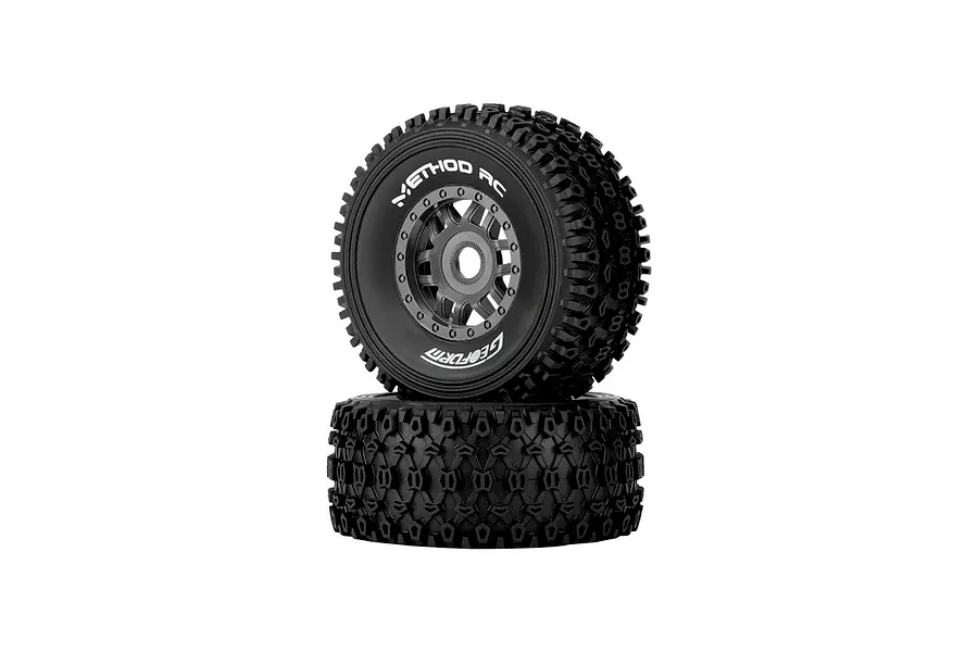 Two Method RC 2.3 Geoform all-terrain tyres mounted on grey 12-spoke rims, stacked vertically against a white background.