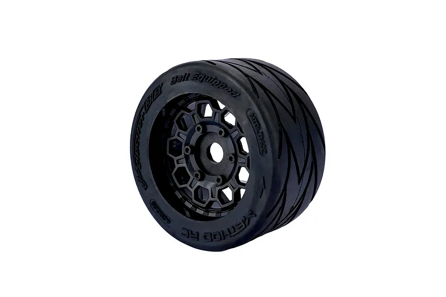 A single Method RC Velociter belted RC car wheel with a black hive-pattern rim and black rubber tyre, isolated on a white background.