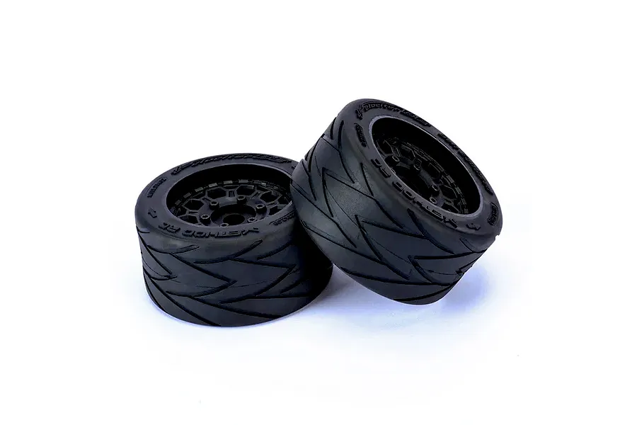 Two Method RC Velociter belted tyres mounted on black Hive rims for 1/7 scale RC cars, shown against a white background.