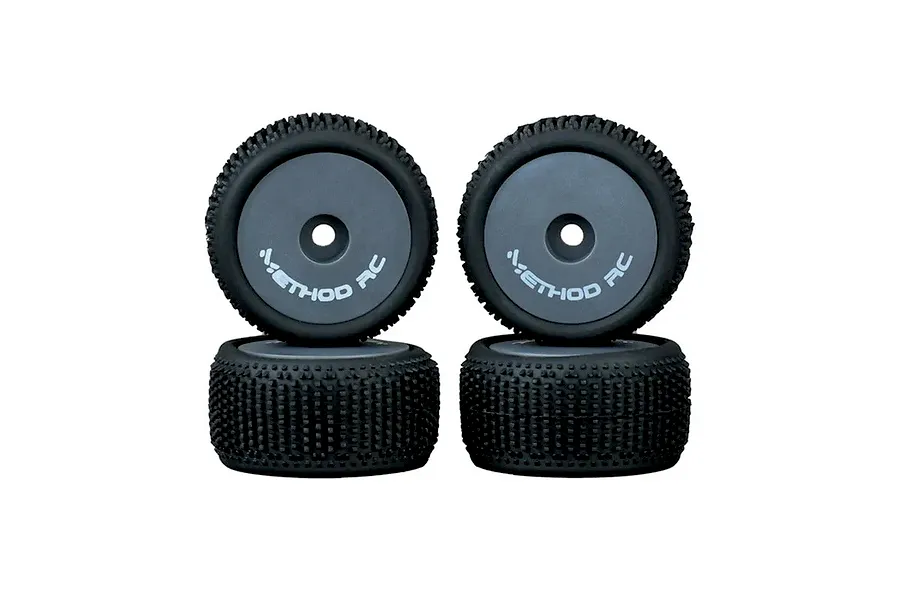 Four Method RC 1/28 scale NitraGrip tyres with grey aero wheels, arranged in two stacks against a white background.