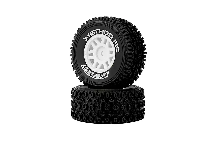 Two Method RC 1.2 Geoform all-terrain tyres mounted on white 12-spoke rims, stacked vertically against a white background.