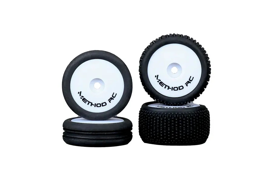 A set of four Method RC 1/24 scale NitraGrip tyres mounted on white aero wheels, shown stacked and upright against a white background.