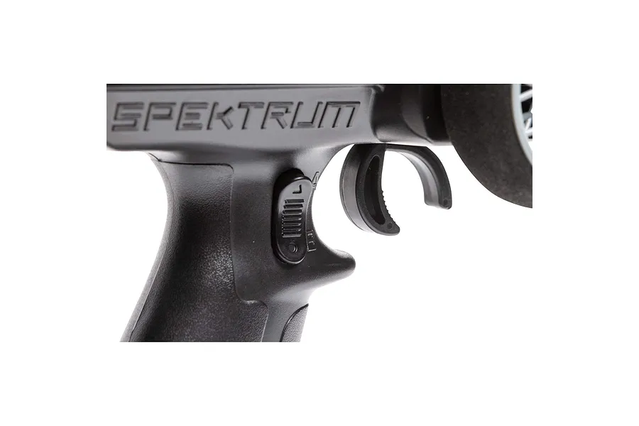 Close-up of the trigger and grip area of a black Spektrum RC transmitter showing the brand logo and adjustment dial.