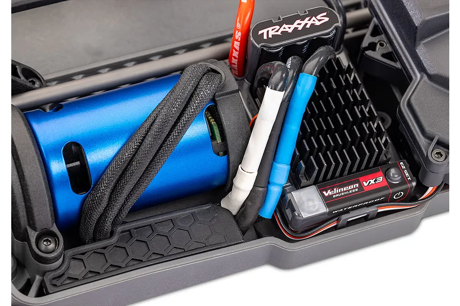 Close-up of the Traxxas Velineon brushless motor and VXL-3s electronic speed control inside a 4-Tec 2.0 RC car chassis.