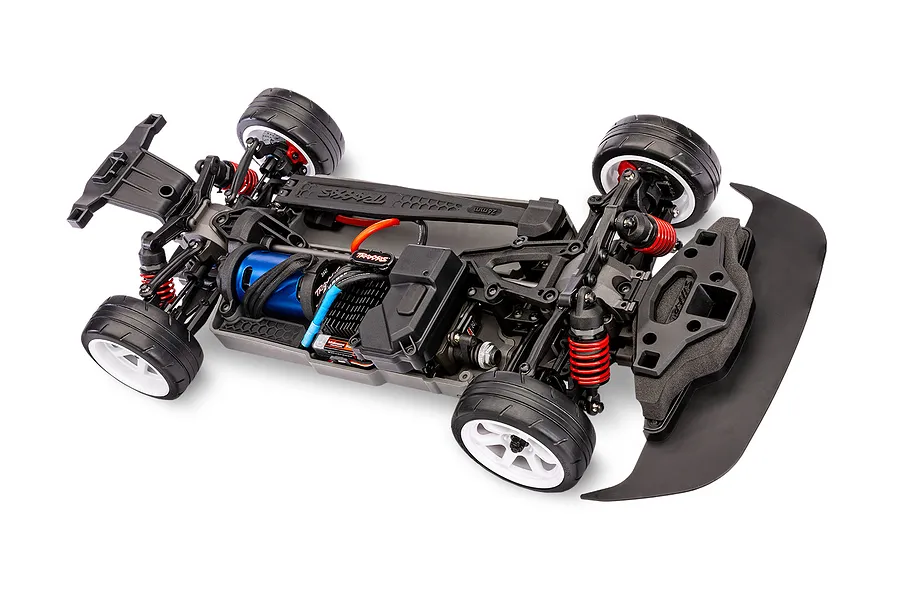 Top-down view of a Traxxas 4-Tec 2.0 RC car chassis without the body shell, showing the motor, suspension, and wheels on a white background.