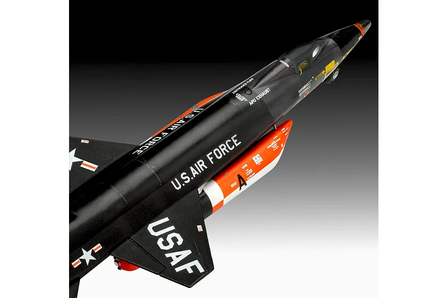 A high-angle close-up of a black and orange North American X-15 model aircraft with U.S. Air Force markings against a gradient grey background.
