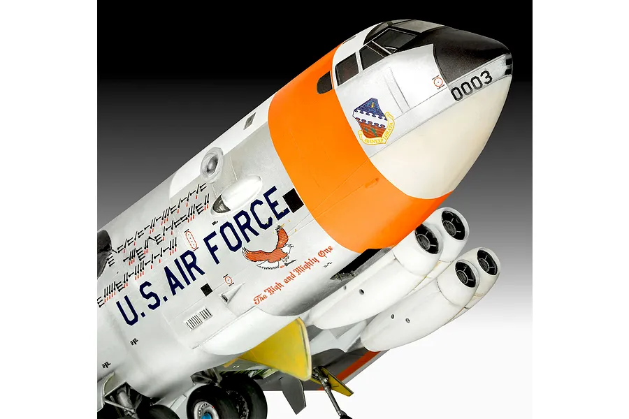 Close-up of a 1/72 scale plastic model of a Boeing NB-52 Stratofortress, showing the silver and orange nose section with U.S. Air Force markings.