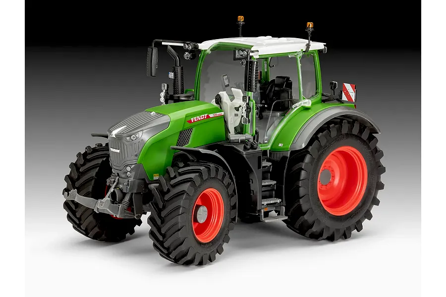A studio shot of a 1/24 scale Revell Fendt 728 Vario tractor model kit, featuring a green body, grey hood, and large black tires with red rims.
