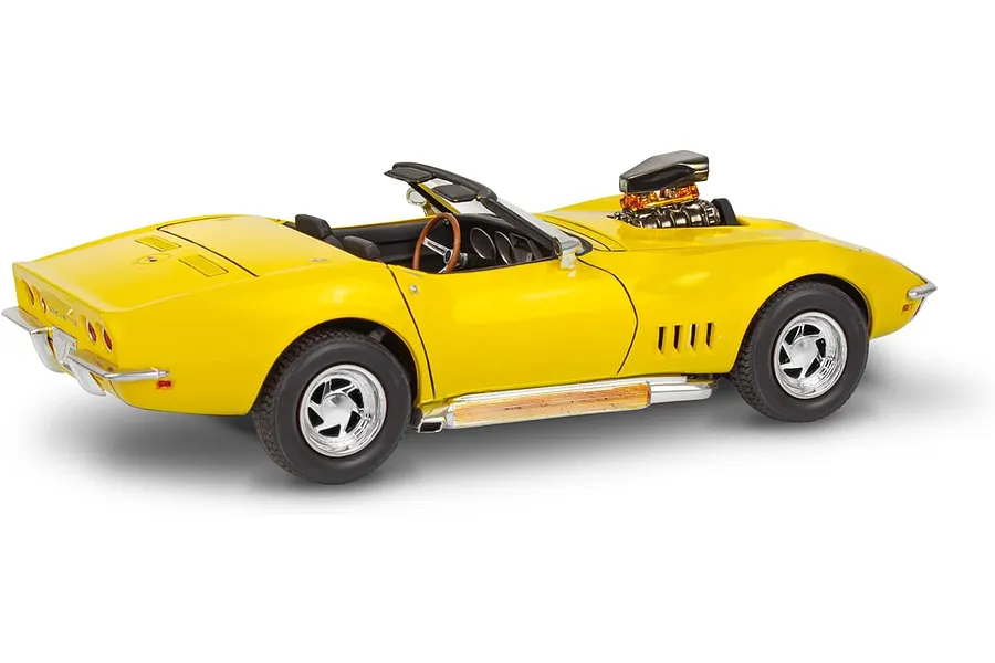 A yellow 1/25 scale model of a 1968 Corvette L-88 roadster with a prominent blower engine protruding from the hood.