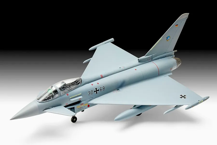 A 1/72 scale plastic model of a Eurofighter Typhoon jet in German Air Force livery, displayed against a black and white gradient background.