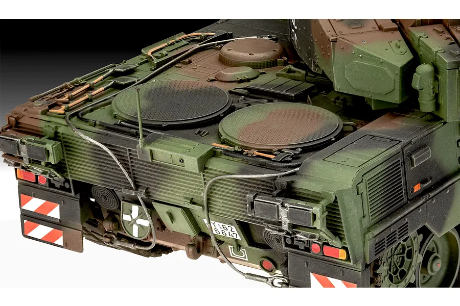 Close-up of the rear deck and engine compartment of a camouflaged Leopard 2A7A1 tank model kit.