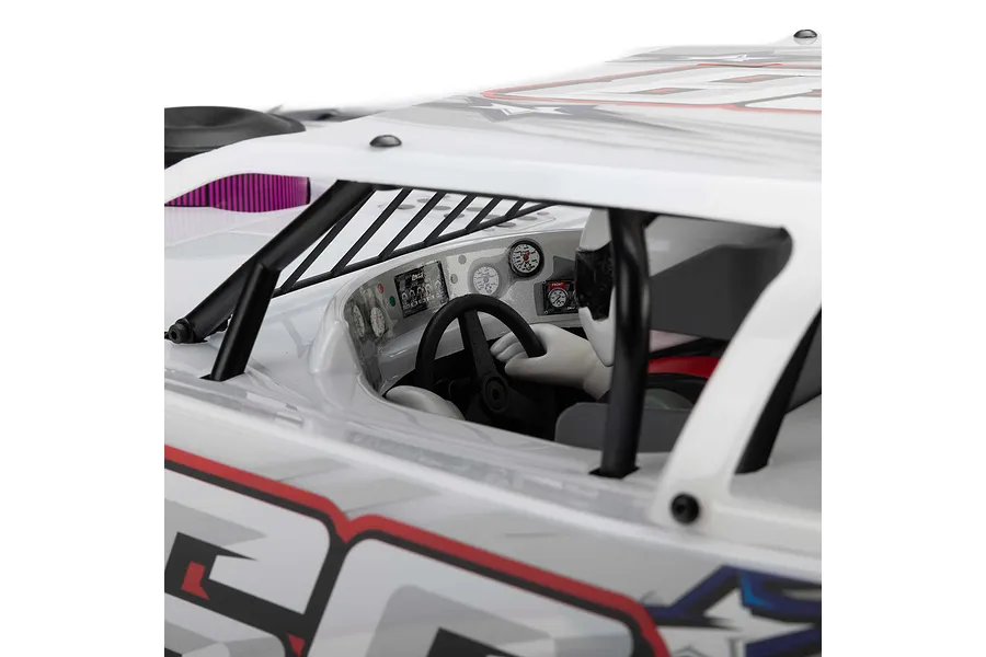 Close-up of the cockpit interior of a Losi 22S Dirt Late Model RC car, showing the driver figure, steering wheel, and detailed dashboard gauges.