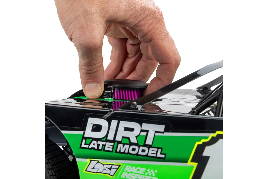 A hand holding the roof-mounted air cleaner detail on a Losi 22S Dirt Late Model RC car.