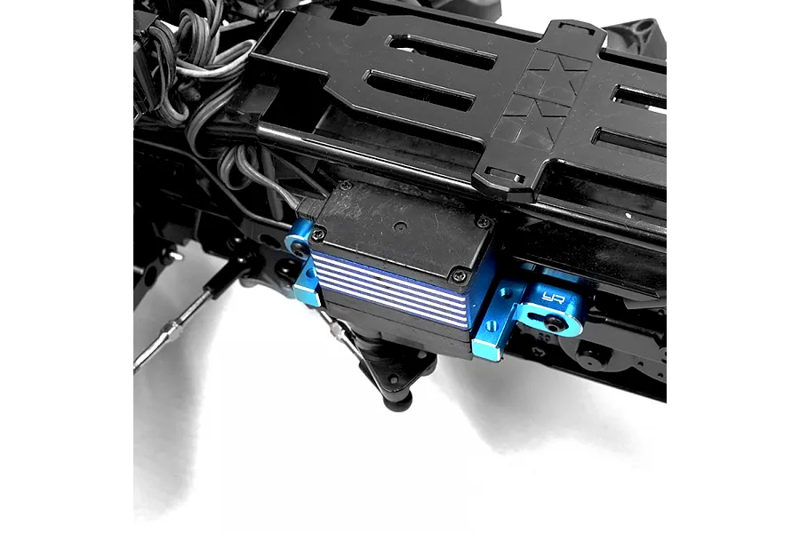 A blue anodized aluminium servo mount installed on an RC car chassis, featuring the Yeah Racing logo.