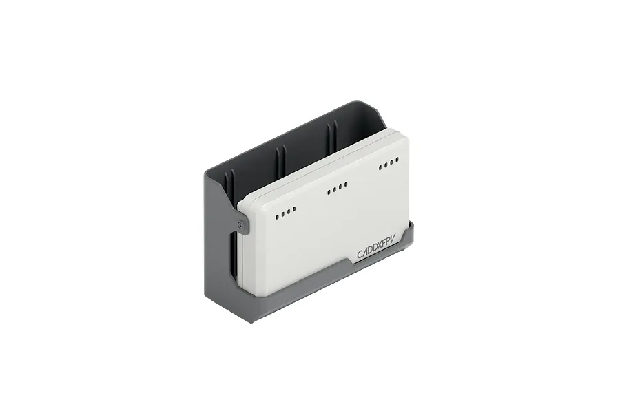 A white CaddxFPV 2S battery charger dock sitting in a grey plastic cradle against a black background.