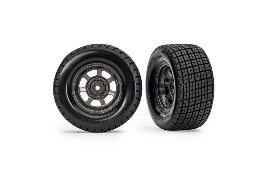 Two Traxxas 1/10 scale Hoosier dirt oval rear wheels with graphite grey rims and black rubber tires on a white background.
