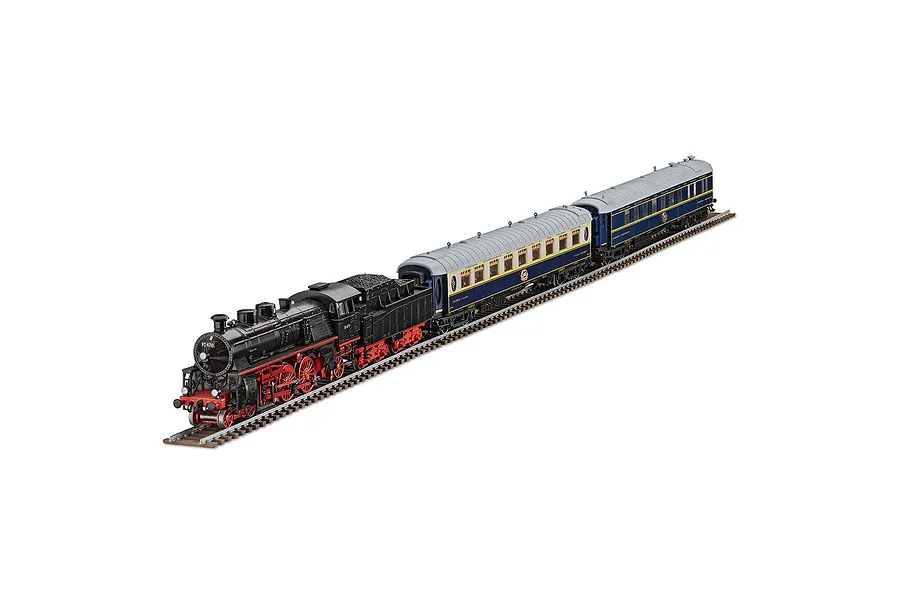 A Revell 1/87 scale Orient Express model train set featuring a black steam locomotive and two blue and yellow passenger carriages on a track.
