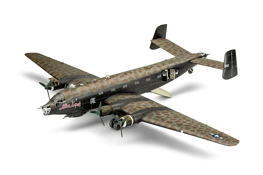 A completed 1/72 scale plastic model of a Junkers Ju 290 aircraft with a camouflage paint scheme and 'Alles Kaputt' nose art.