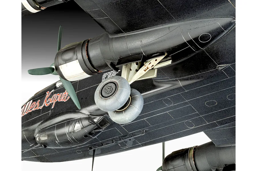 Close-up of the underside of a black Junkers Ju 290 model aircraft showing the landing gear, engine nacelle, and propeller.