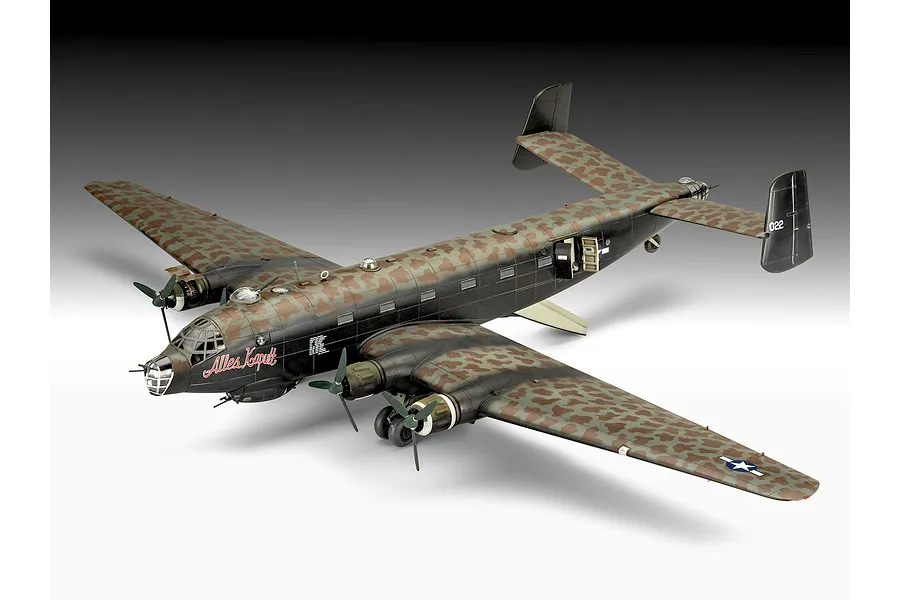 A completed 1/72 scale plastic model of a Junkers Ju 290 military aircraft with a mottled camouflage paint scheme and 'Alles Kaputt' text on the nose.