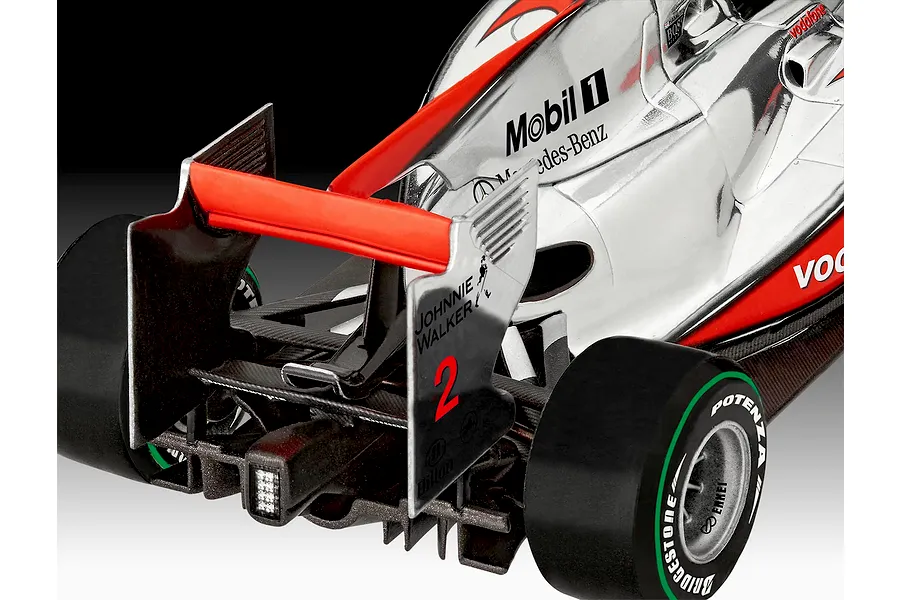 Close-up of the rear section of a McLaren Mercedes Formula 1 model car, showing the rear wing, diffuser, and sponsor decals.
