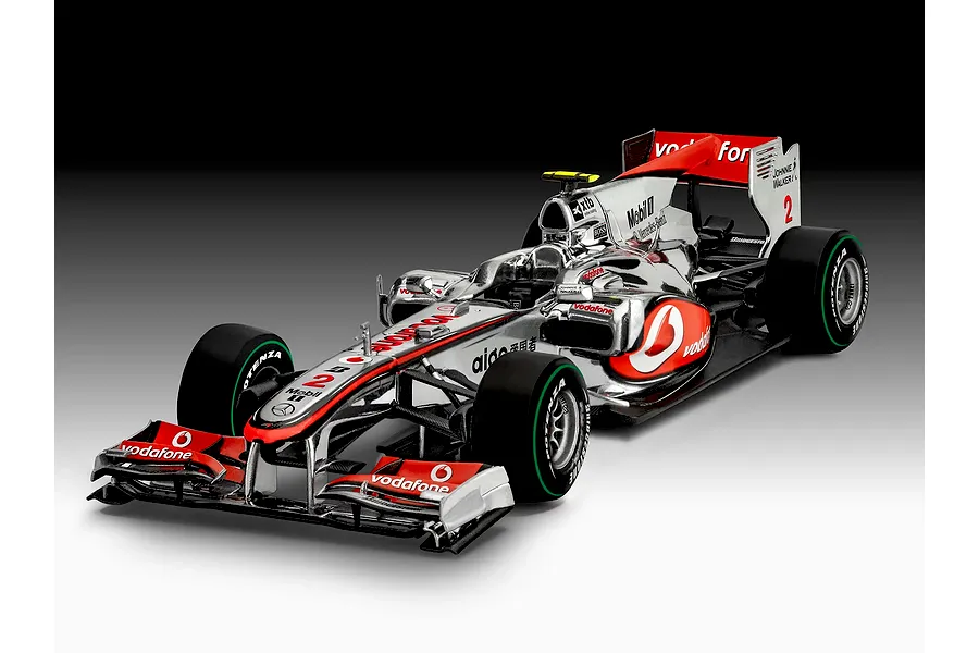 A studio shot of a 1/24 scale Revell Vodafone McLaren Mercedes MP4-25 Formula 1 model car, featuring chrome silver bodywork with red and black branding.