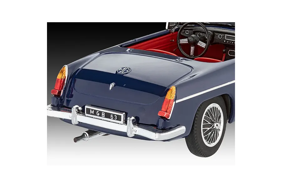 Rear three-quarter view of a dark blue Revell 1/32 scale MGB Roadster model car featuring a red interior and chrome wire wheels.