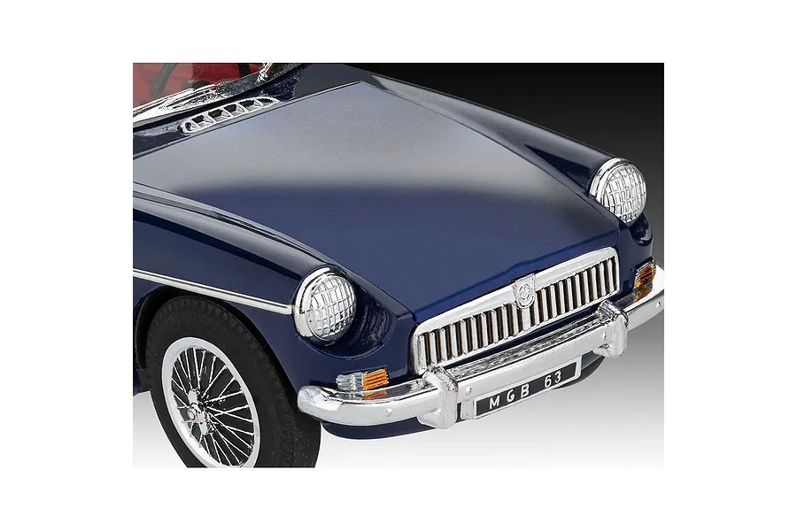 Close-up of a dark blue MGB Roadster model car showing the front hood, grille, chrome bumper, and wire-spoke wheel.