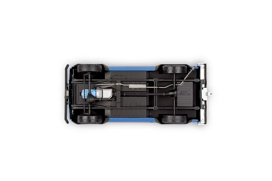 Underside view of a 1/25 scale model 1978 Chevy 4X4 pickup truck showing the chassis, drivetrain, and exhaust system.