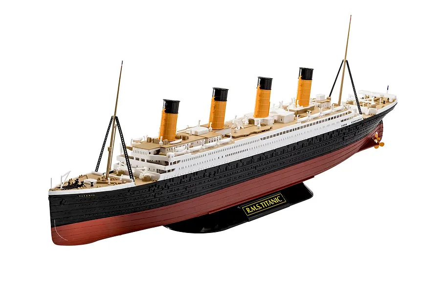 A fully assembled 1/600 scale plastic model of the R.M.S. Titanic, featuring black, white, and red hull details with yellow funnels, mounted on a black display stand.
