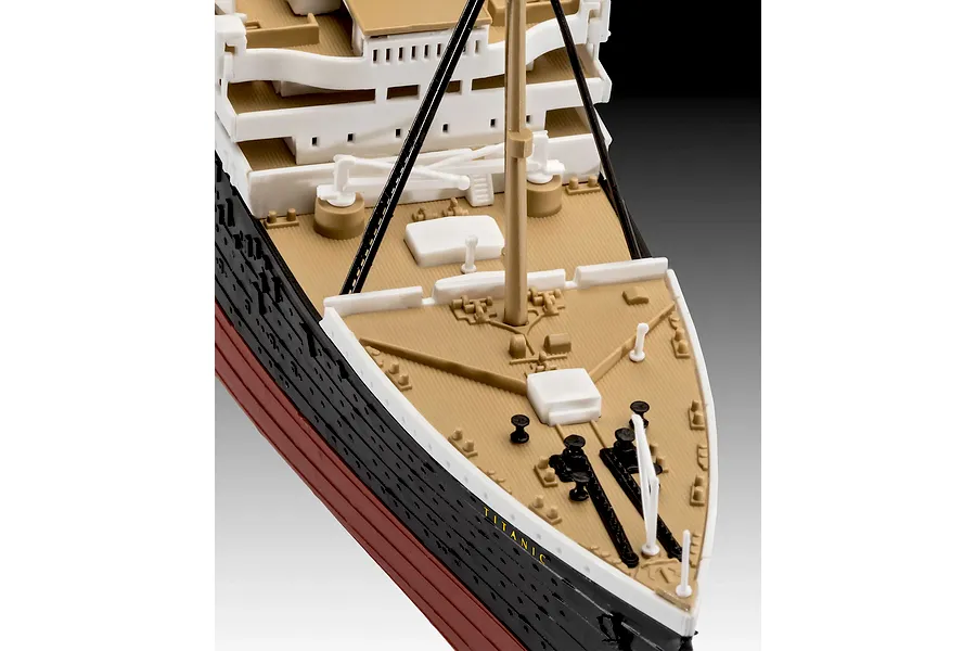 Close-up of the bow section of a Revell 1/600 scale RMS Titanic plastic model kit, showing the deck, mast, and hull details.