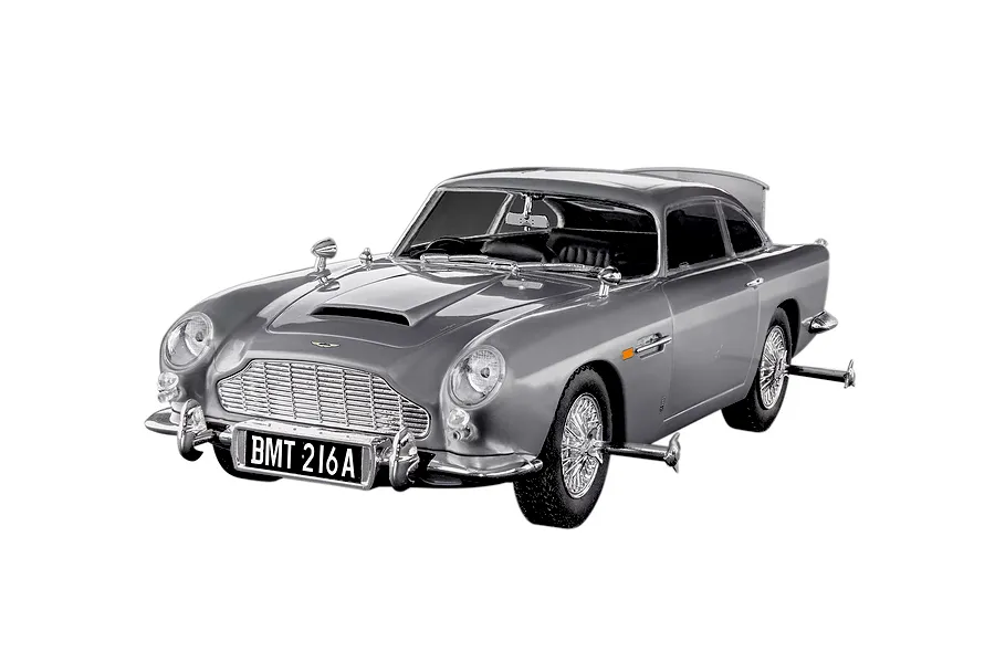 A completed 1/24 scale Revell Aston Martin DB5 model car in silver, featuring the iconic BMT 216A license plate and James Bond gadget details.