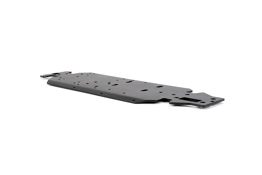A black Rovan aluminium V5 main chassis plate for an RC car, viewed from a low angle against a white background.