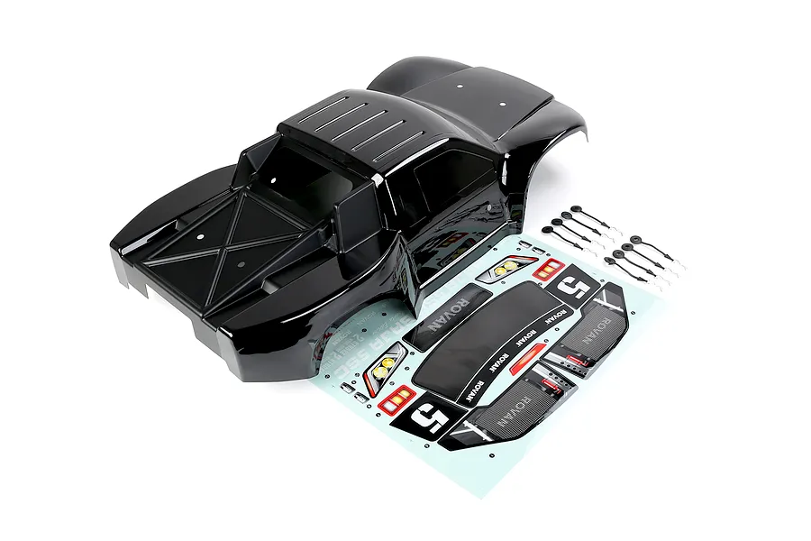 A black Rovan 1/5 scale 5SC short course RC truck body shell with a decal sheet and body clips on a white background.