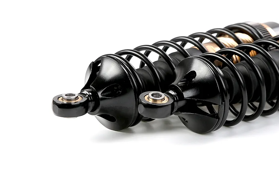 Two Rovan aluminium front adjustable RC shock absorbers in bronze and black finish, shown against a white background.
