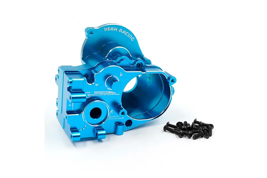A blue anodized aluminium complete gearbox housing for 1/10 RC cars by Yeah Racing, shown with a small pile of black mounting screws on a white background.