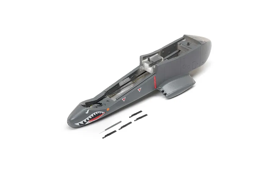 A grey E-Flite RC plane fuselage with shark mouth nose art and several small black plastic gun barrel accessories on a white background.