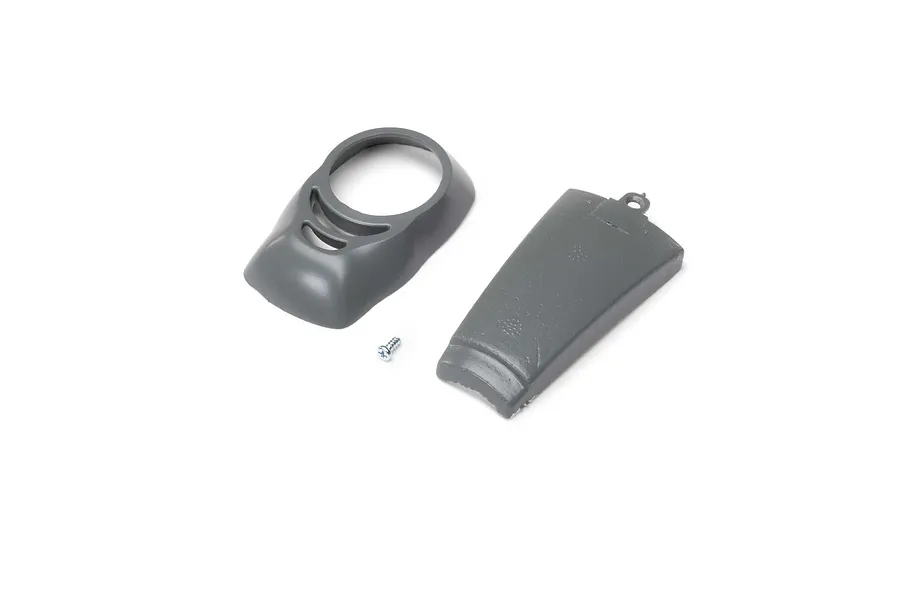 A grey plastic RC plane cowl, motor hatch, and a small metal screw on a white background.
