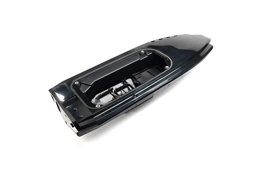 A black RC boat hull shown from a high angle, featuring an open cockpit area and internal mounting structures.