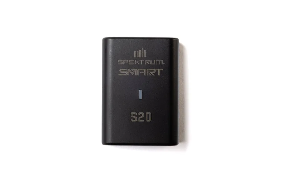 Top-down view of a black Spektrum S20 Smart LiPo charger unit on a white background.