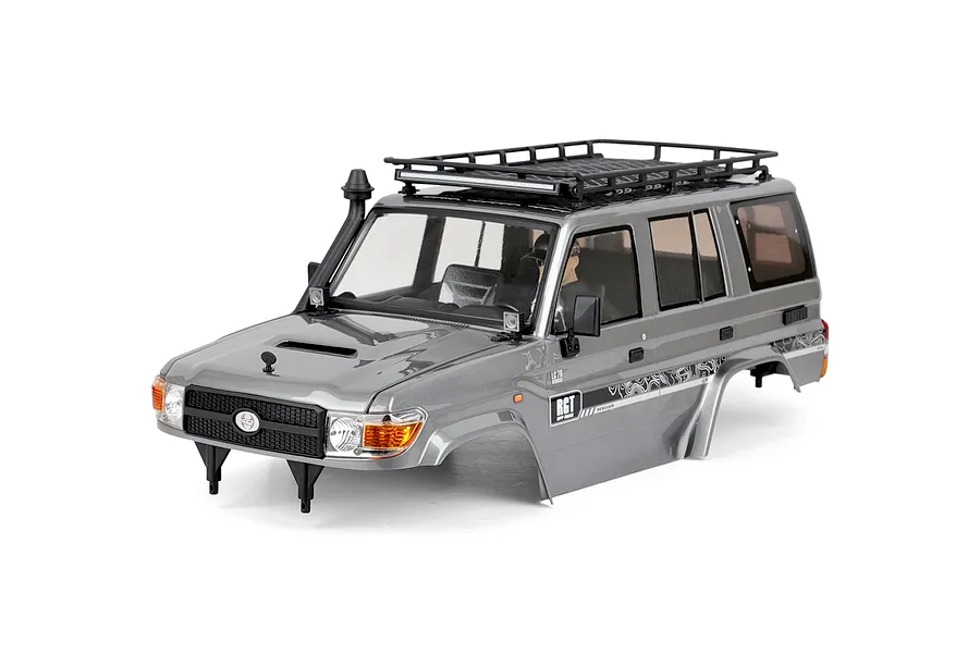 A silver grey RGT 1/10 scale Rescuer LC76 RC crawler body shell featuring a roof rack, snorkel, and detailed decals on a white background.