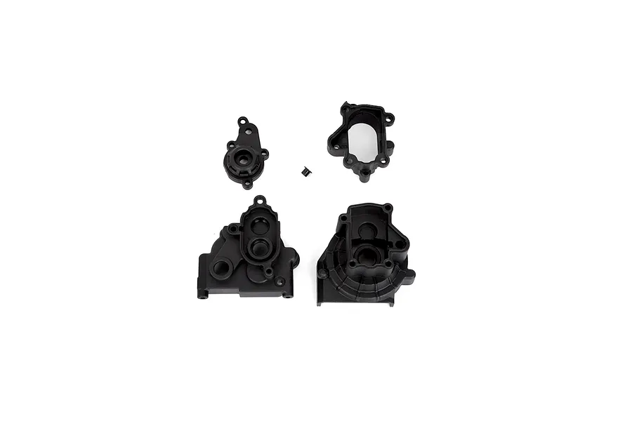 A set of black plastic RGT transmission case components laid out on a white background.